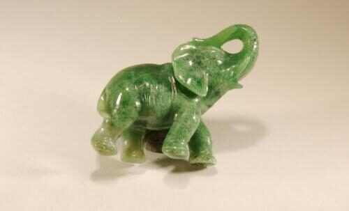 An elephant carved out of a green stone