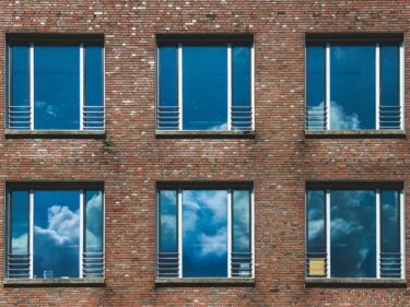 Six windows on a brick building