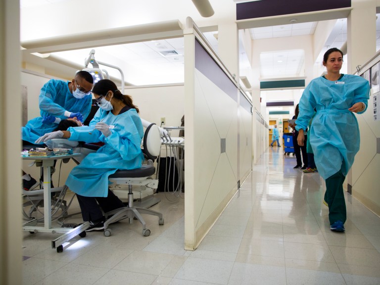 Harvard dental students working in a dental hospital