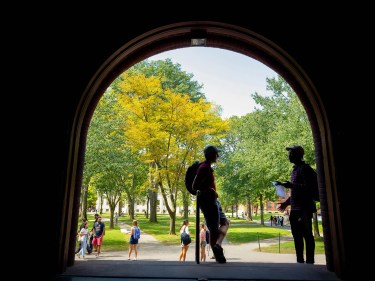 Two students talking in the Yard