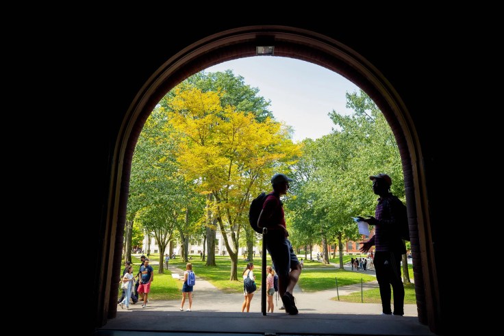 Two students talking in the Yard