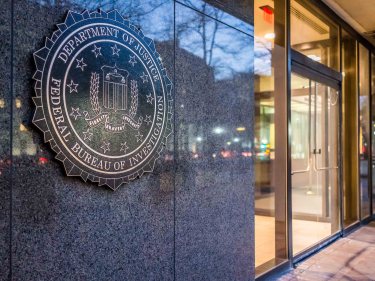 The shield of the FBI on the side of a building