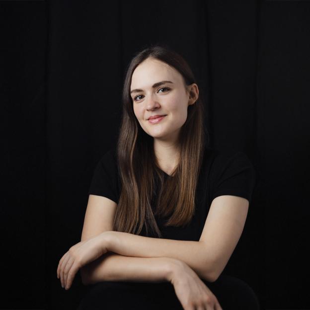 A woman with a black background.